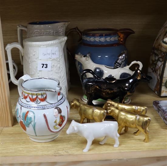 Four Victorian moulded jugs, two cow creamers etc.